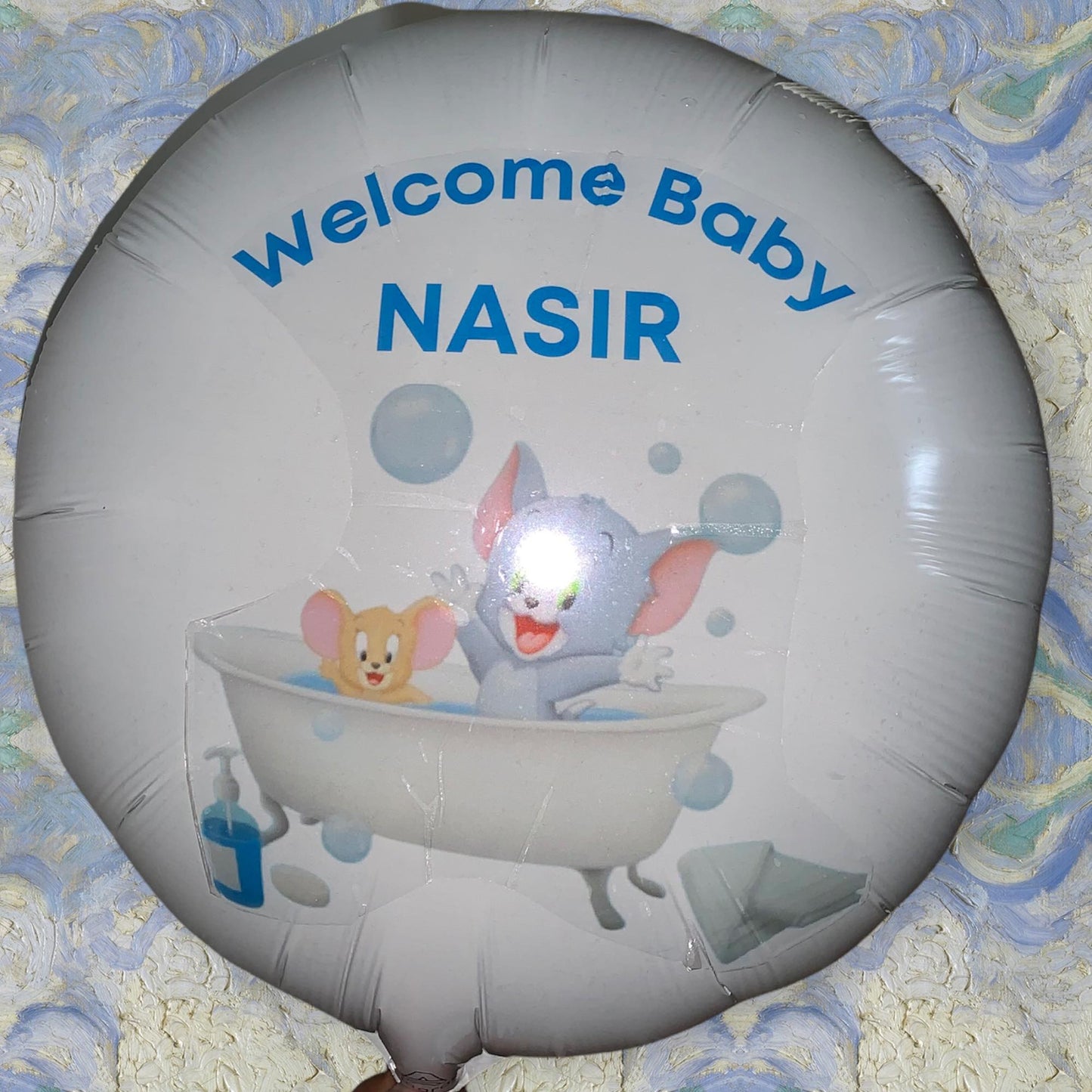 A K B N K custom-made balloon with the words welcome baby Nasir on it, featuring distinct characteristics.